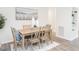 Dining room with a table, six chairs, white walls and modern artwork at 2581 Green Valley Blvd, Burlington, NC 27217