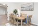 Dining room with a wood table, six chairs, and a modern painting at 2581 Green Valley Blvd, Burlington, NC 27217