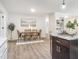 Open-concept dining room with wood floors and modern decor, creating a cozy and inviting atmosphere at 2581 Green Valley Blvd, Burlington, NC 27217