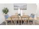 Well-lit dining room with wood furniture, modern decor, and bright walls at 2581 Green Valley Blvd, Burlington, NC 27217