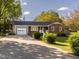 Attractive home with a brick and siding exterior, an attached garage, and mature landscaping at 2581 Green Valley Blvd, Burlington, NC 27217