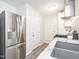 Kitchen with a stainless steel refrigerator and sink, offering a view to an adjacent room at 2581 Green Valley Blvd, Burlington, NC 27217