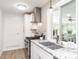 Well-lit kitchen with stainless steel appliances and granite countertops, offering both functionality and style at 2581 Green Valley Blvd, Burlington, NC 27217