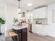 Open kitchen boasts stainless steel appliances, granite countertops and an island with barstool seating at 2581 Green Valley Blvd, Burlington, NC 27217