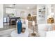 Open-concept living space with a kitchen island, dining table, and bookshelf at 2581 Green Valley Blvd, Burlington, NC 27217