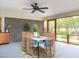 Inviting screened porch with seating, a ceiling fan, and an outside view at 2581 Green Valley Blvd, Burlington, NC 27217