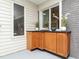 Covered patio with cabinet space, ideal for dining and outdoor entertainment at 2581 Green Valley Blvd, Burlington, NC 27217