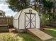 Outdoor storage shed with double doors and ramp providing easy access for equipment and tools at 2581 Green Valley Blvd, Burlington, NC 27217