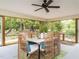 Relaxing sunroom with wicker furniture and tranquil views of the surrounding greenery at 2581 Green Valley Blvd, Burlington, NC 27217