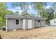 Back exterior featuring gray siding, newly replaced roof, and lots of space at 2612 Glenbrook Dr, Durham, NC 27704