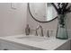 Bathroom vanity with brushed nickel faucet, decor, and quartz countertop at 2612 Glenbrook Dr, Durham, NC 27704