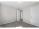 Bedroom with neutral paint and plush new carpet featuring large windows for ample natural light at 2612 Glenbrook Dr, Durham, NC 27704