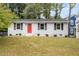 Charming single-story home with a freshly painted exterior and a vibrant red front door at 2612 Glenbrook Dr, Durham, NC 27704