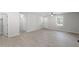 Bright living room featuring new floors, neutral paint, ceiling fan, and natural light from the exterior window at 2612 Glenbrook Dr, Durham, NC 27704