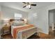 Bedroom with hardwood floors, white walls, large closet, and lots of natural light at 2709 Farthing St, Durham, NC 27704