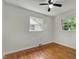 Bedroom with hardwood floors, white walls, and lots of natural light at 2709 Farthing St, Durham, NC 27704