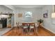 Cozy dining area featuring hardwood floors and a picturesque window view at 2709 Farthing St, Durham, NC 27704