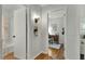 Hallway view featuring hardwood floors with views into the bathroom and living room at 2709 Farthing St, Durham, NC 27704