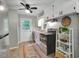 Bright kitchen featuring stainless steel appliances, painted cabinets and hardwood flooring at 2709 Farthing St, Durham, NC 27704