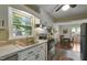 Well-lit kitchen with stainless steel appliances and ample counter space at 2709 Farthing St, Durham, NC 27704