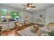 Sun-drenched living room featuring stylish furniture and a large picture window at 2709 Farthing St, Durham, NC 27704