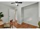 Office with hardwood floors, white walls, and a view into the living room at 2709 Farthing St, Durham, NC 27704