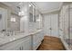 Bathroom with white cabinets, marble countertops, double sinks, and glass-enclosed shower at 2908 Stubble Field Dr, Raleigh, NC 27613