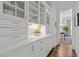 Beautiful butler's pantry with custom cabinets, drawers, wine rack, and views into the next room at 2908 Stubble Field Dr, Raleigh, NC 27613