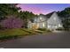 Stunning exterior elevation of a two-story home with landscaped yard, driveway, and mature trees at 2908 Stubble Field Dr, Raleigh, NC 27613