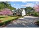 Beautiful two-story home with a driveway, manicured lawn, and flowering trees at 2908 Stubble Field Dr, Raleigh, NC 27613