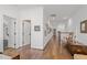 Hallway featuring wood floors, white walls, and white trim at 2908 Stubble Field Dr, Raleigh, NC 27613