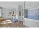 Spacious laundry room and dog washing station featuring patterned tile floors, natural light, and built-ins at 2908 Stubble Field Dr, Raleigh, NC 27613