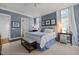 Inviting main bedroom features a ceiling fan, built-in lighting, and views of an attached bathroom at 2908 Stubble Field Dr, Raleigh, NC 27613