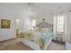 Bright main bedroom filled with natural light features hardwood floors and attached bathroom at 2908 Stubble Field Dr, Raleigh, NC 27613