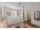 Comfortable main bedroom boasts natural light, and a view into an adjoining bathroom at 2908 Stubble Field Dr, Raleigh, NC 27613