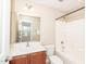 Bathroom features shower/tub combo and modern vanity and mirror at 3000 Summerhouse Rd, Cary, NC 27519