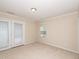 Bedroom with a large window with blinds and neutral carpet at 3000 Summerhouse Rd, Cary, NC 27519