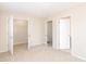 This bedroom features two closets and access to an adjacent bathroom and hallway at 3000 Summerhouse Rd, Cary, NC 27519