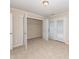 Bedroom with large closet and doors leading to the outside at 3000 Summerhouse Rd, Cary, NC 27519