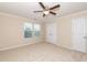 Bedroom features ceiling fan, closet and two windows at 3000 Summerhouse Rd, Cary, NC 27519