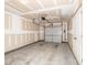 Spacious garage with an automatic door opener and ample space for parking and storage at 3000 Summerhouse Rd, Cary, NC 27519
