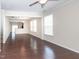 Living room featuring large windows, neutral paint, and hardwood flooring at 3000 Summerhouse Rd, Cary, NC 27519