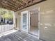 Exterior view of patio with double doors leading into the home at 3000 Summerhouse Rd, Cary, NC 27519