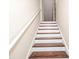 Staircase view with white risers and dark wood treads at 3000 Summerhouse Rd, Cary, NC 27519