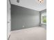 Comfortable bedroom featuring neutral carpet and a bright, airy window at 311 Windrush Ln, Durham, NC 27703