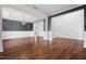 Elegant dining room featuring hardwood floors, decorative trim, and a stylish chandelier at 311 Windrush Ln, Durham, NC 27703
