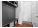 Functional mudroom with built-in storage, bench seating, and convenient access to the home's entrance at 311 Windrush Ln, Durham, NC 27703