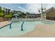 Gathering-friendly splash pad with interactive water features, adjacent to the main pool and clubhouse at 311 Windrush Ln, Durham, NC 27703