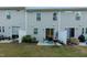 Backyard patio area with outdoor seating, grill, and manicured lawn, perfect for entertaining at 313 Kineton Woods Way Way, Garner, NC 27529