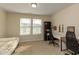 Bedroom featuring a study space with black shelving and natural lighting at 313 Kineton Woods Way Way, Garner, NC 27529